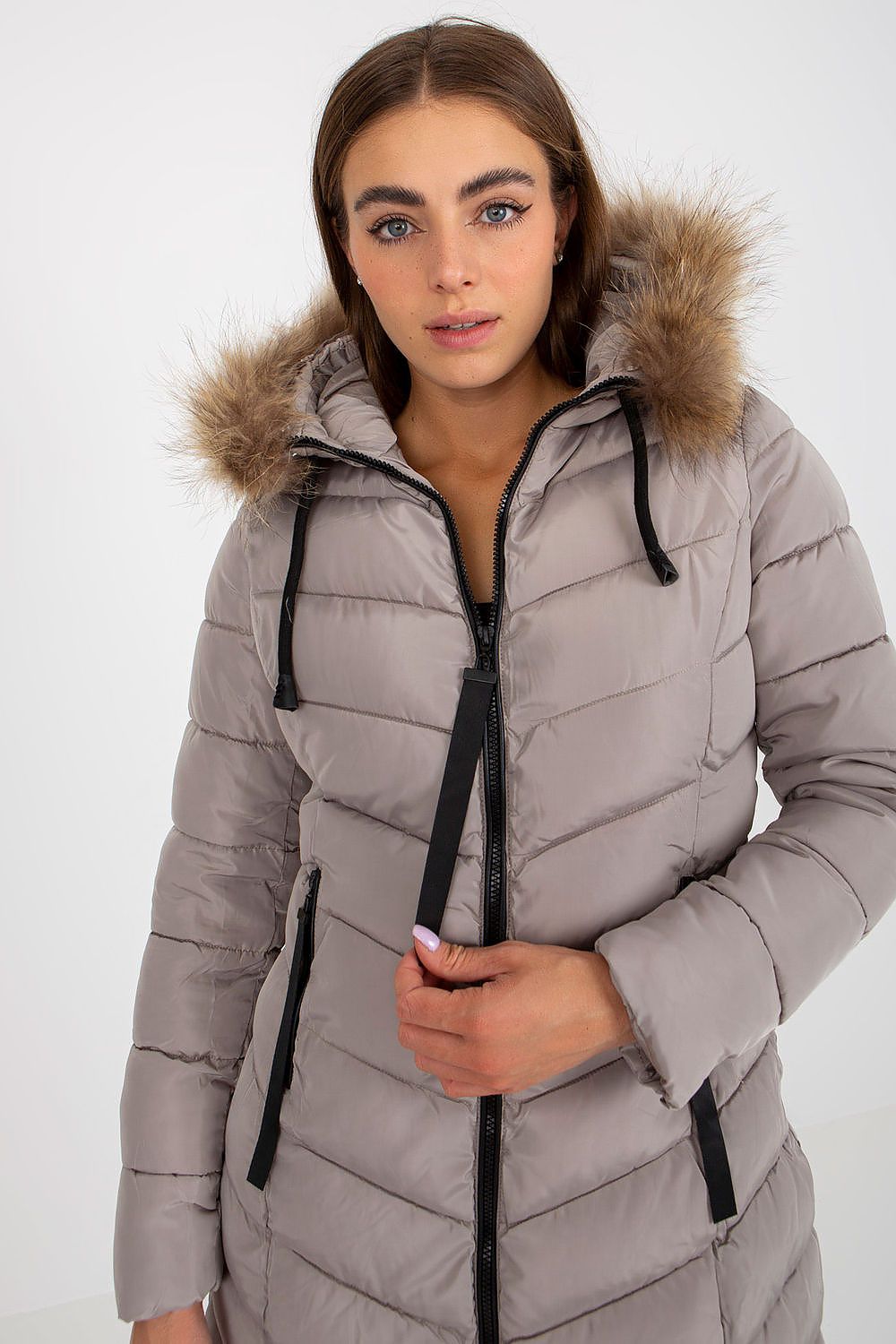Luxury NM polyester jacket for women featuring a stylish fur-trimmed hood, perfect for winter elegance and comfort.