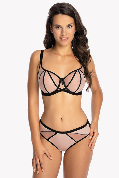 Model wearing Gaia Soft Gaia balconette bra in light pink tulle paired with matching bottoms, highlighting the exquisite black ribbon accents.