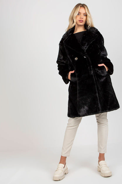 Chic and luxurious long sleeve fur coat in deep black by Och Bella, featuring a fully lined design and elegant slip pockets, styled with cream trousers and sophisticated footwear, perfect for upscale winter fashion.