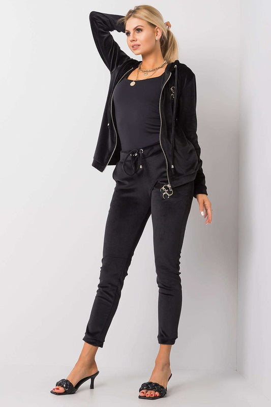 Chic black velour two-piece outfit, comprising a comfortable zip-up hoodie and stylish pants with a waist tie, perfect for casual luxury.