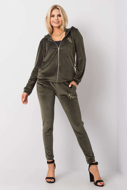 Glamorous olive green velour two-piece set, including a zip-up hoodie and tailored pants, exuding luxury and style.