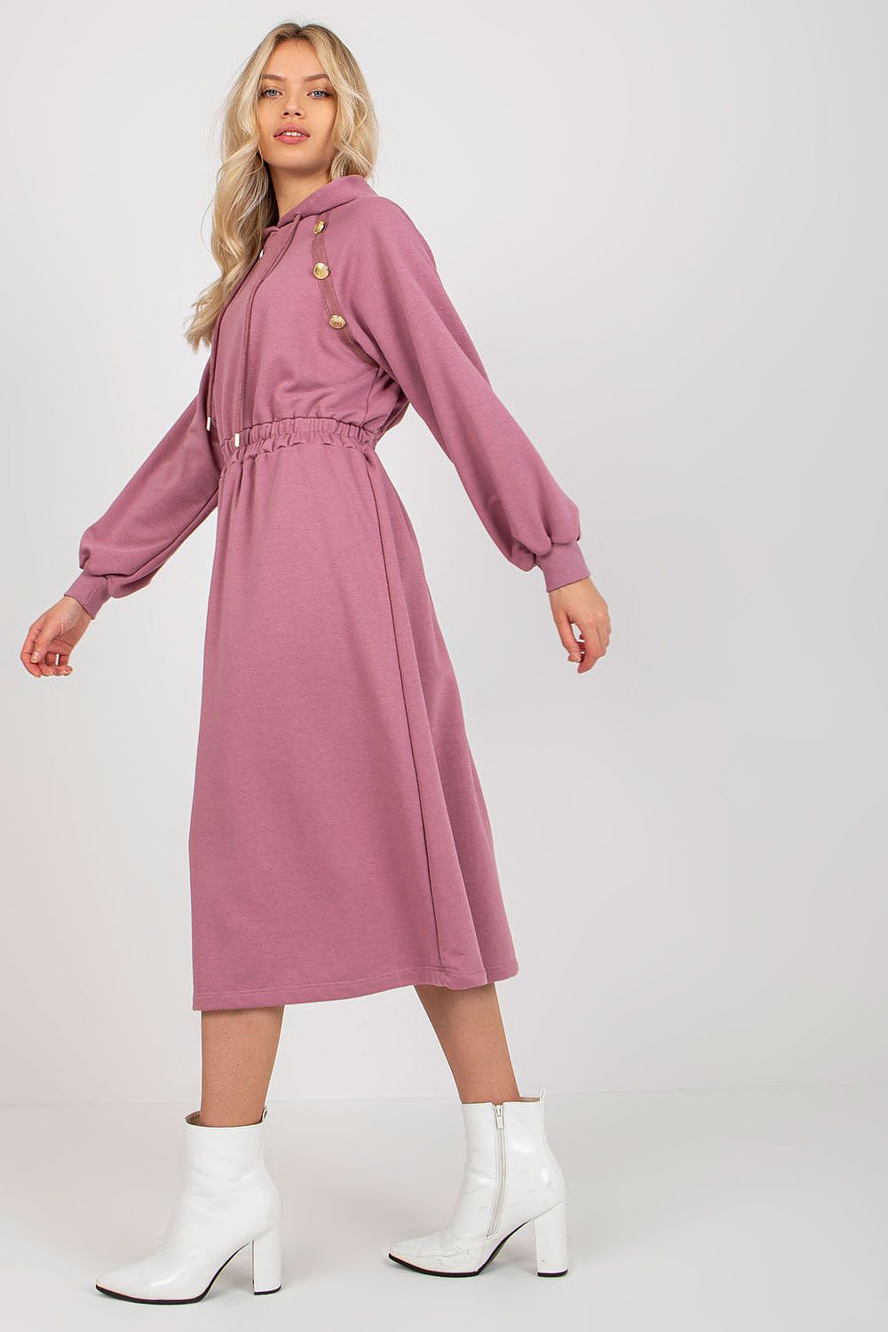 Profile view of a premium mauve cotton hoodie dress with long sleeves and decorative buttons, elegantly cinched at the waist for a flattering silhouette.