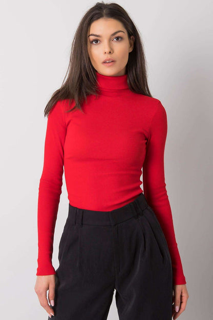 Close-up view of a refined red fitted turtleneck, showcasing its smooth texture and elegant silhouette, perfect for effortless luxury styling.