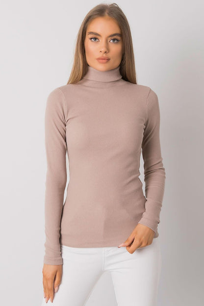 Elegant fitted cotton turtleneck in soft beige, featuring long sleeves and a sophisticated look, ideal for versatile outfits.