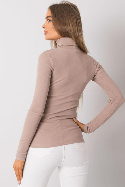 Chic back view of a fitted beige cotton turtleneck, accentuating sleek long sleeves and a modern style for effortless elegance.