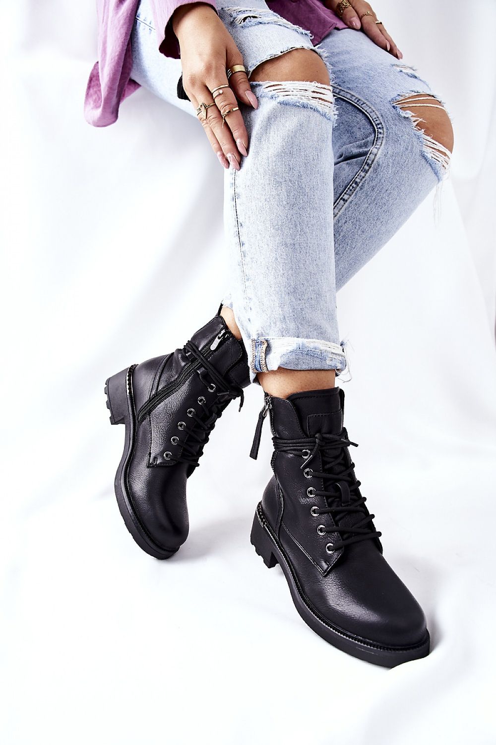 Luxury ecological leather worker boots featuring dual zippers and laces, designed for comfort and style, showcased with distressed jeans in a modern setting.