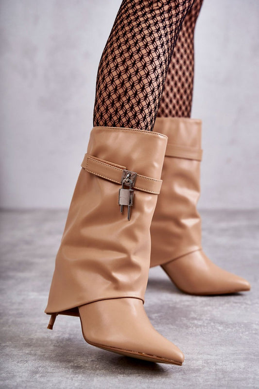 Luxury eco leather stiletto heel slip-on boots in soft beige, featuring a removable decorative strap with a padlock detail, paired with elegant fishnet tights for a chic and sophisticated look.