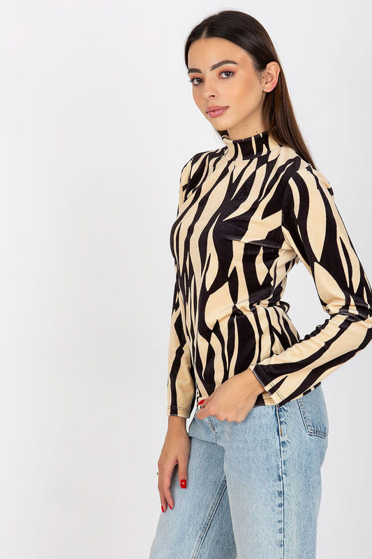 Chic animal print velour blouse with long sleeves and a sleek stand-up collar, showcasing contemporary fashion on a model.