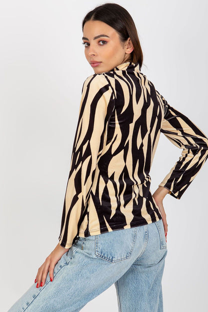 Sophisticated velour blouse in a striking animal print, viewed from the back on a model, perfect for upscale occasions.