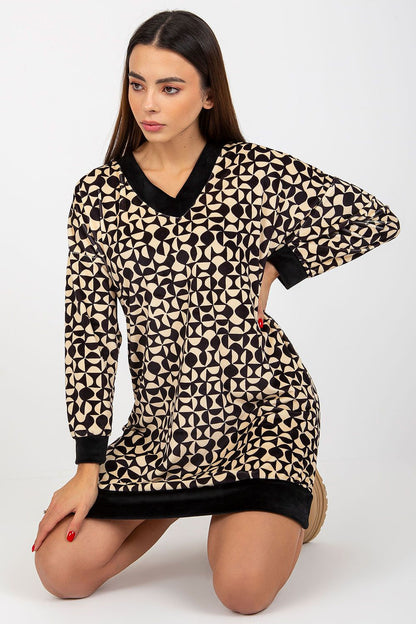Stylish short velour dress with a unique geometric pattern in cream and black, designed with a v-neckline and long sleeves for a modern touch.