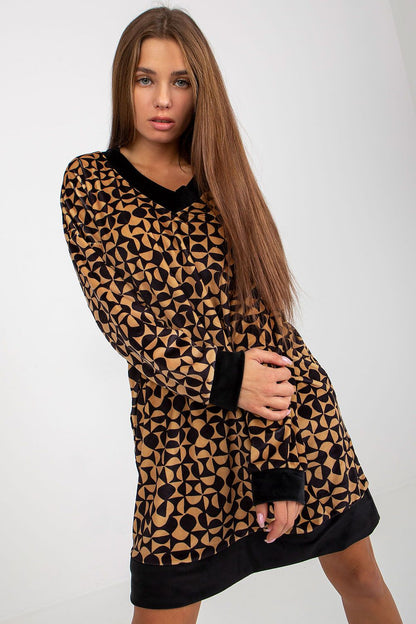 Chic short velour dress featuring a modern geometric pattern, complemented by a v-neck and contrast cuffs, offering a luxurious everyday look.