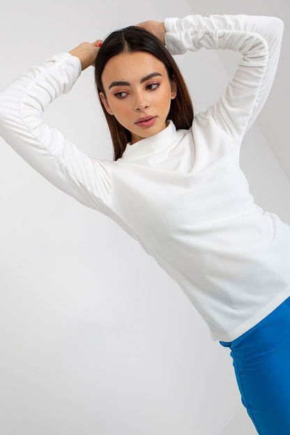 Stylish white velvet blouse with long sleeves and a chic stand-up collar, showcased by a confident female model.