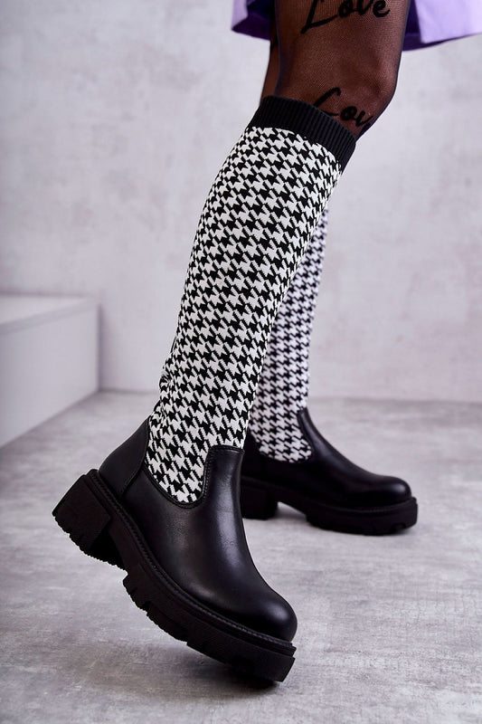 Elegant women's thigh-high boots in eco leather with a stylish houndstooth patterned fabric. Features a flattering flat heel and premium insulated design, perfect for chic winter outings.