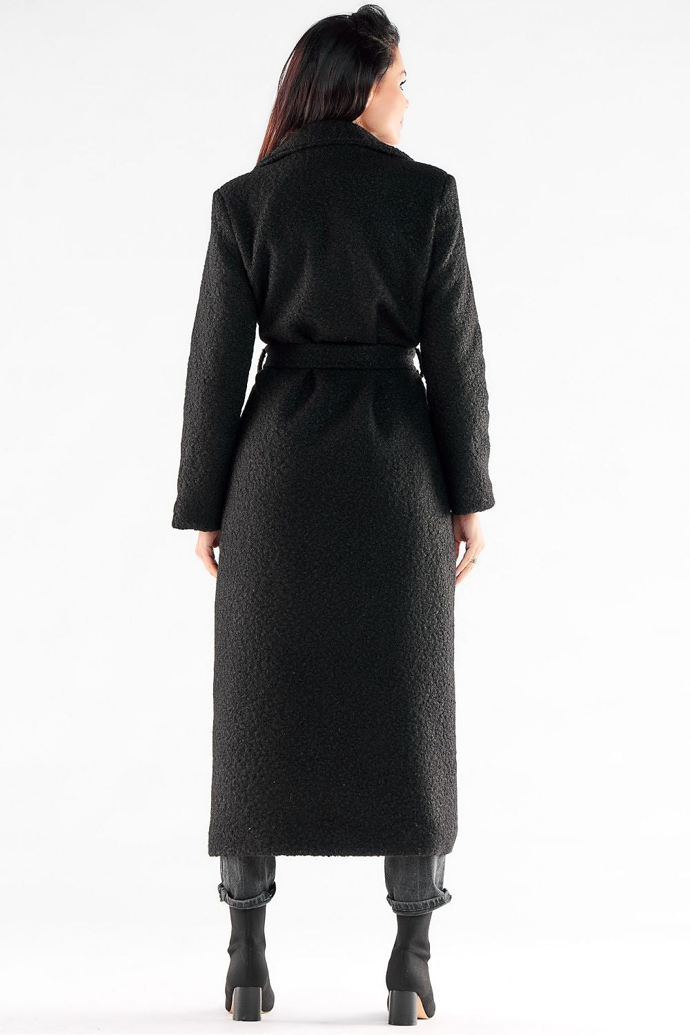 Back view of a glamorous black maxi coat by Awama, elegantly belted, highlighting the luxurious fabric and streamlined design.