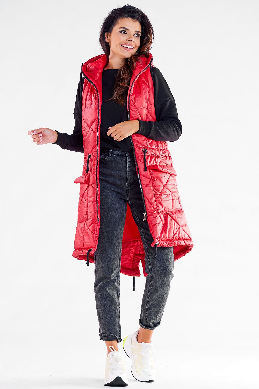 Stunning red quilted hooded gilet by Awama, featuring a chic design and adjustable elements, worn by a model who embodies autumn elegance.