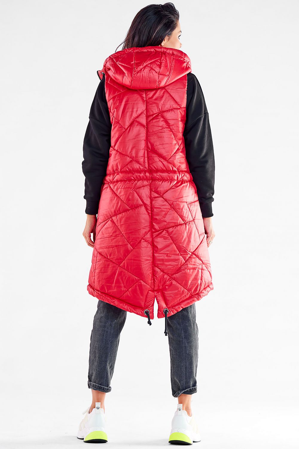 Elegant red quilted hooded gilet from Awama, designed for autumn evenings, featuring adjustable waist and pockets, model shown from the back.