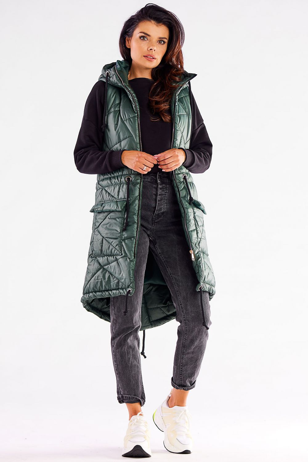 Sophisticated green quilted hooded gilet by Awama, model presenting the front view, designed with practicality and style for cooler days.