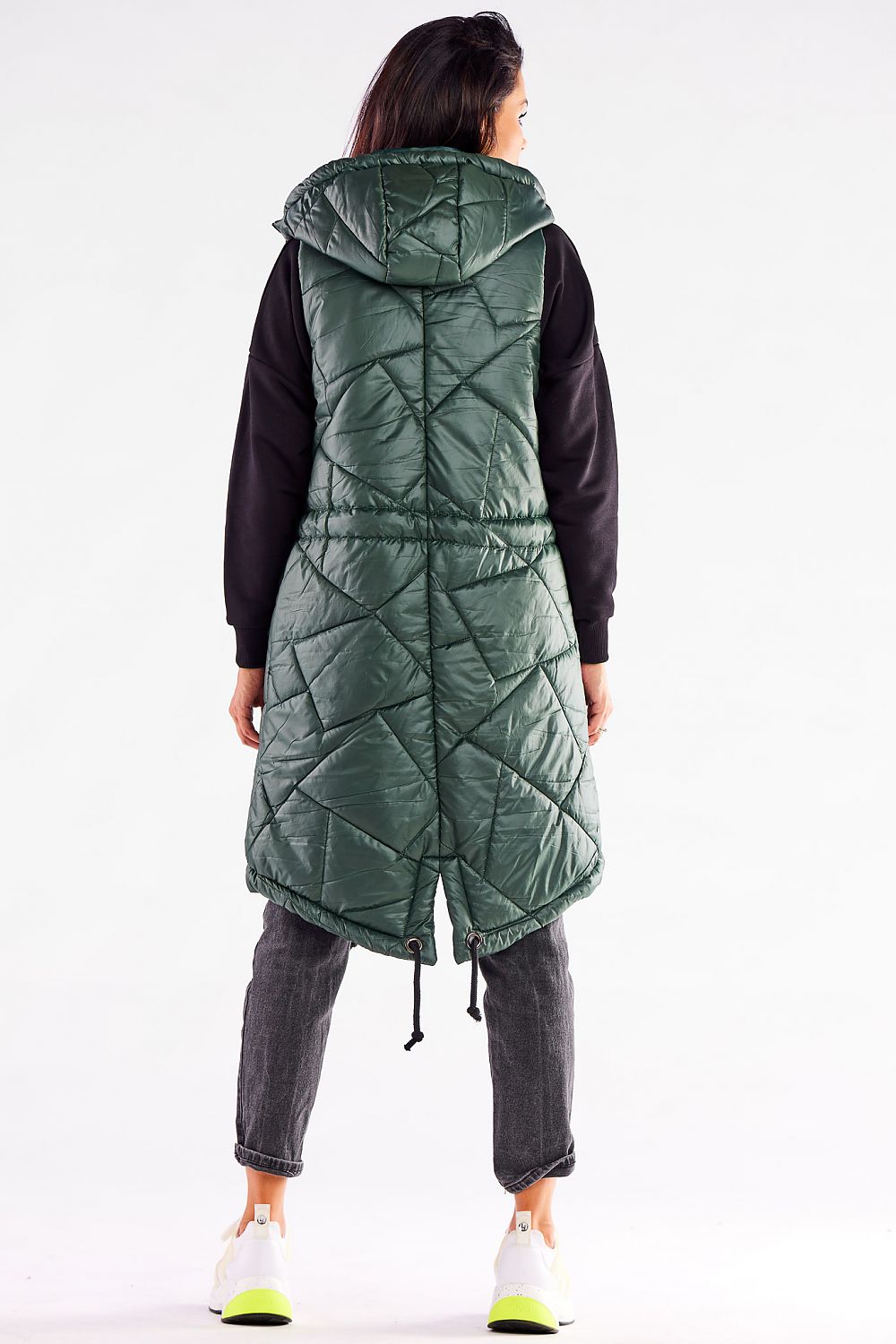 Fashionable green quilted hooded gilet by Awama, photographed from the back, highlighting the adjustable features and modern design.