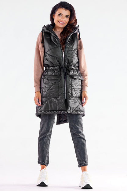 Elegant luxury quilted hooded gilet from Awama, featuring adjustable drawstring waist, showcased with a model smiling, ideal for autumn evenings.