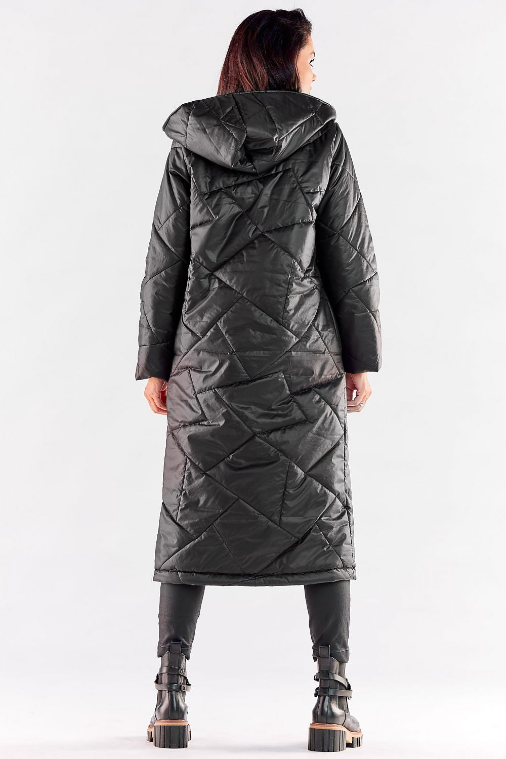 Elegant woman in a luxury long quilted coat with large hood, showcasing the stylish back design and generous length, perfect for autumn and winter fashion.
