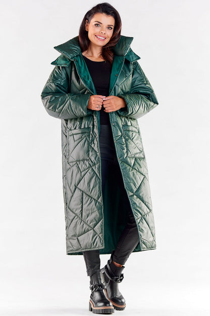Stylish long green quilted coat with a plush oversized hood, designed for warmth and elegance in autumn and winter.