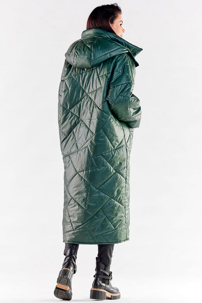 Elegant back view of a long quilted coat in rich green, showcasing its large hood and chic design for cold weather fashion.