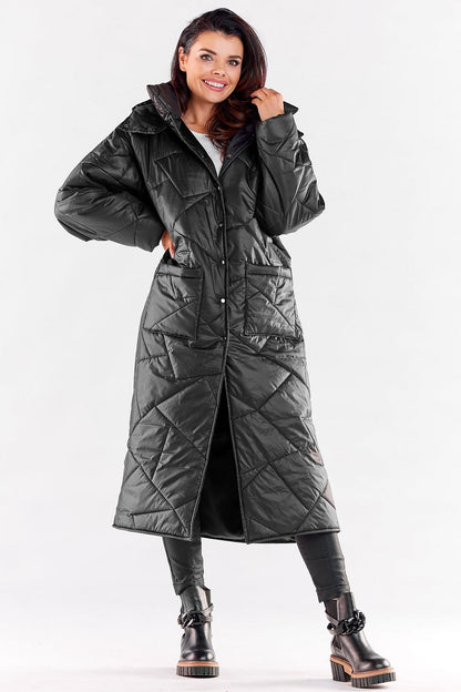 Sophisticated long quilted coat in classic black, designed with a stylish hood and functional pockets, perfect for winter elegance.