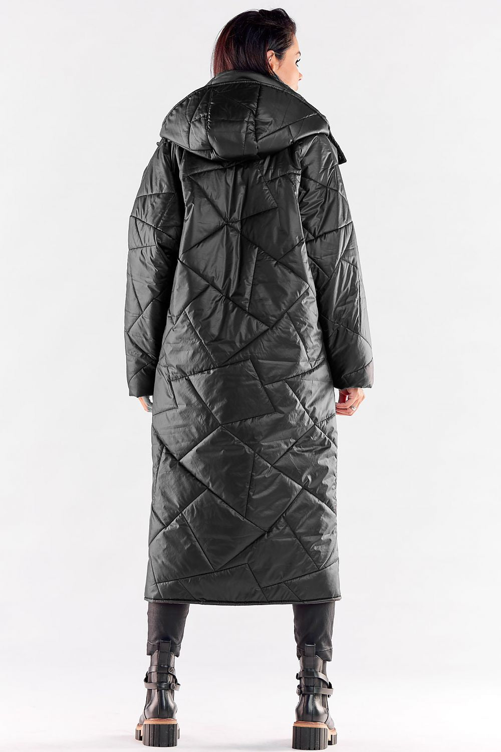 Chic back view of a long black quilted coat with a large hood, highlighting its luxurious design and practical features for colder climates.