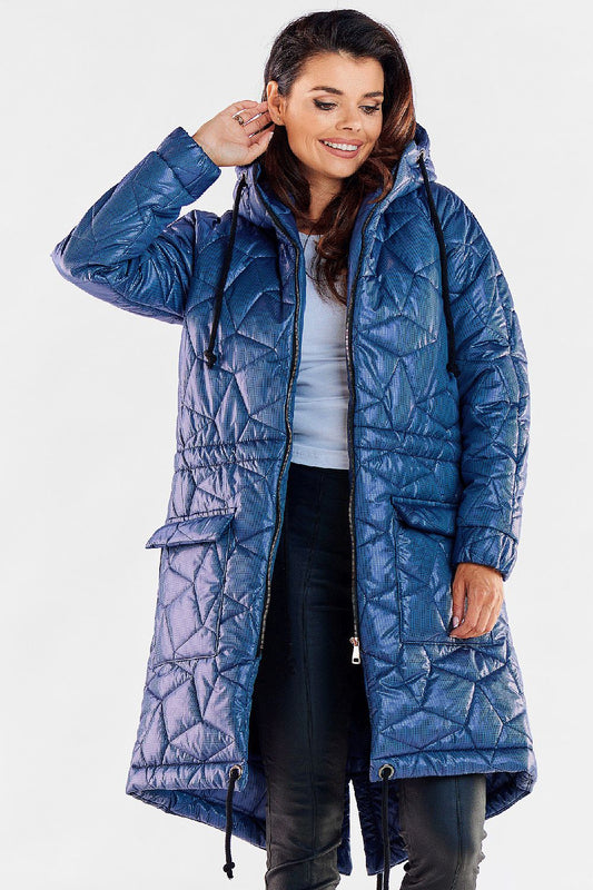 Stylish woman wearing a luxury quilted knee-length jacket in blue with a hood and drawstring waist, showcasing a chic casual look.