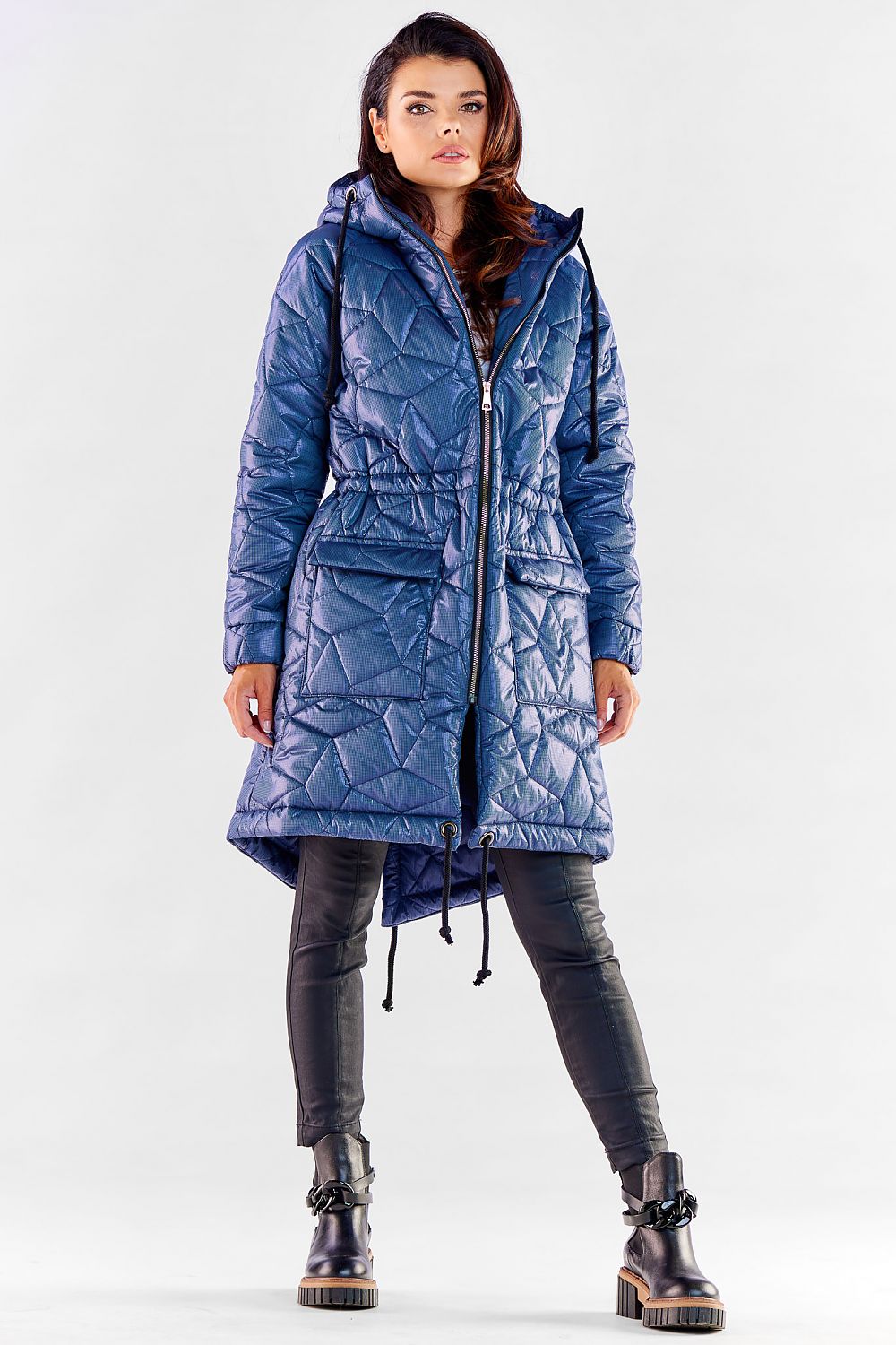Elegant blue quilted knee-length jacket with a hood and drawstring waist, designed for a modern and sophisticated style.
