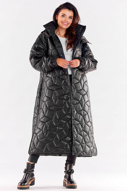 Stylish luxury long quilted coat in black with a hood, designed for ultimate comfort and elegance, featuring ribbed sleeves and a flattering knee slit.