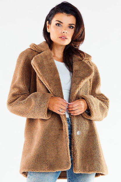Elegantly styled Awama women's hip-length fur coat in soft brown, featuring decorative buttons and a chic collar, perfect for a luxurious winter outfit.