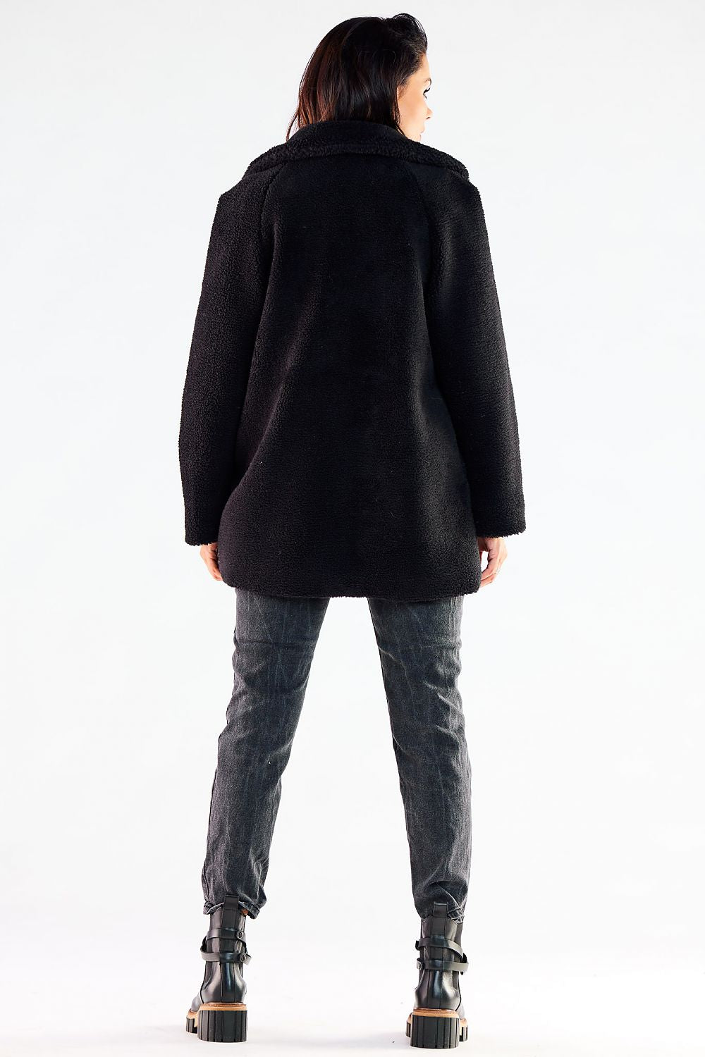 Back view of a luxurious black fur coat, showcasing its premium texture, stylish design, and relaxed fit, ideal for both casual and formal winter outfits.