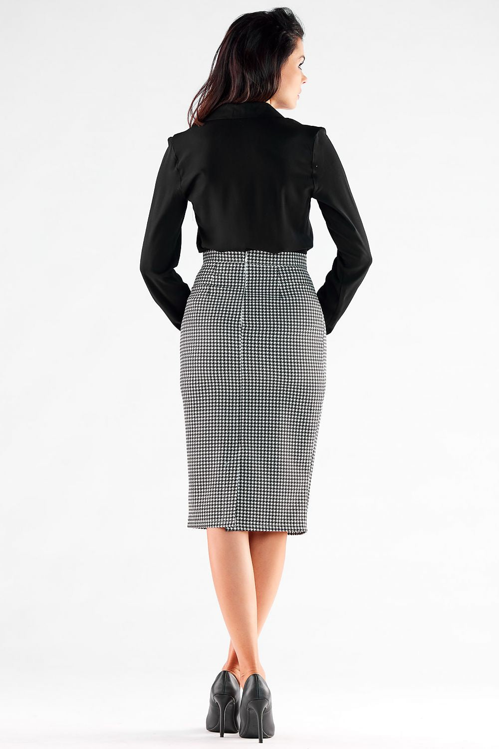 Back view of an elegant midi pencil skirt with lining by Awama, presenting a refined silhouette with a fitted design, paired with a chic black blouse, perfect for professional settings.