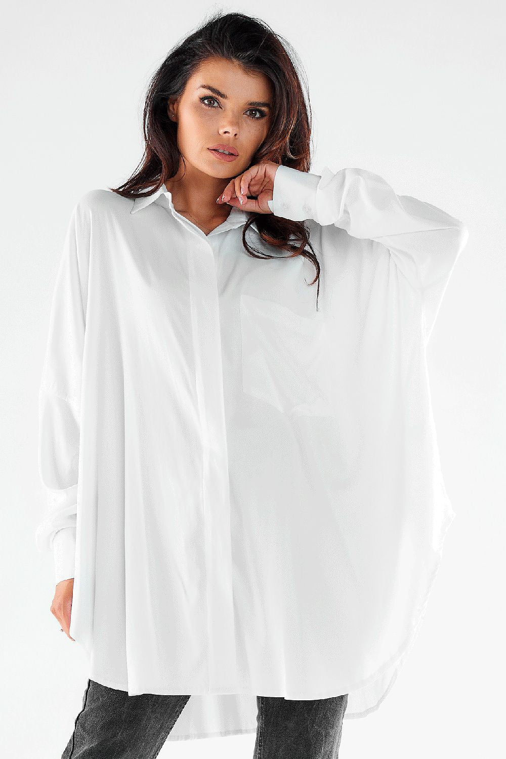 Elegant women's long sleeve oversized white shirt, showcasing a loose fit and chic styling, perfect for versatile looks from casual to formal.