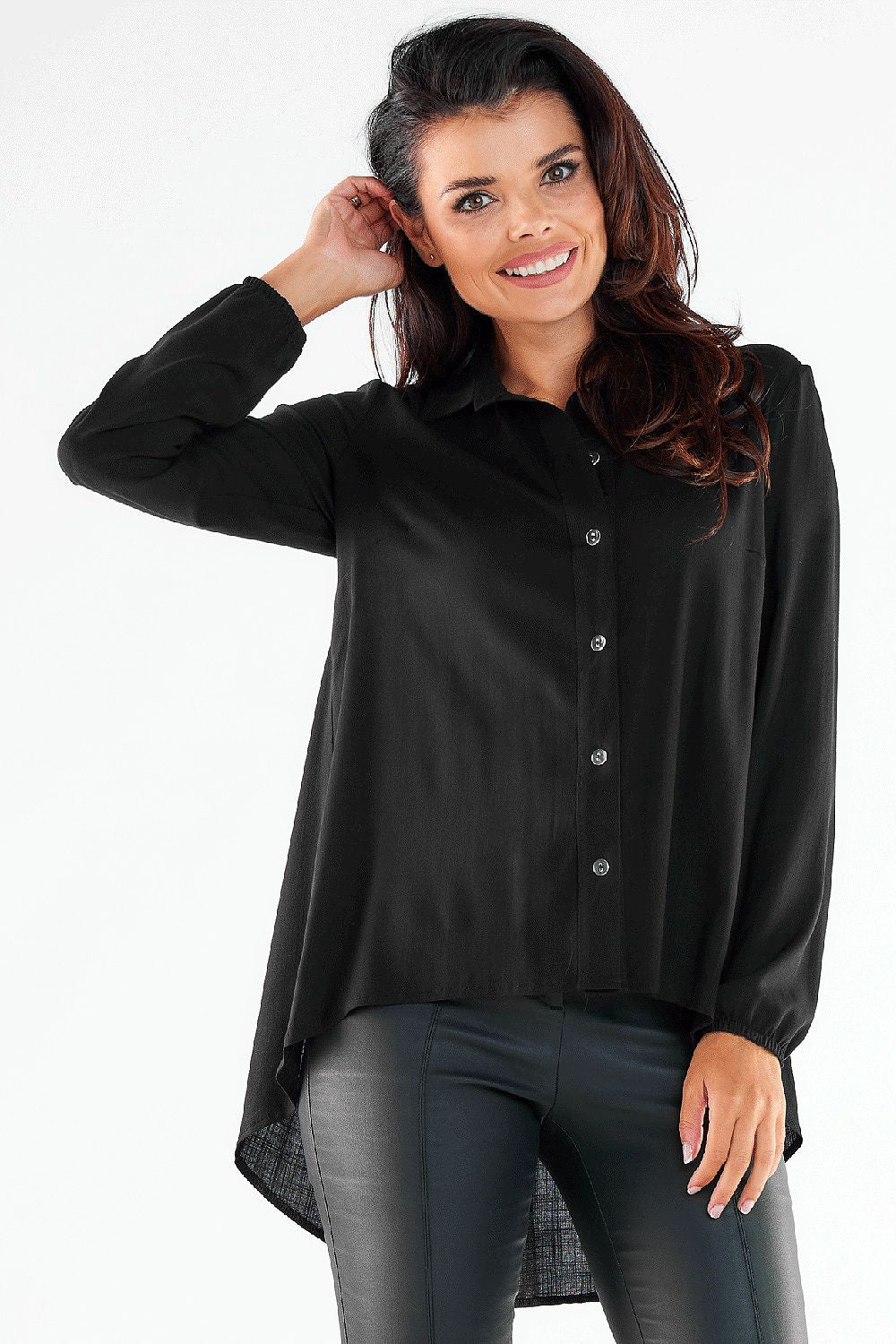 Sophisticated black button-up long sleeve shirt with elastic cuffs, exuding modern elegance, paired with stylish imitation leather pants.