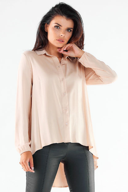 Luxurious light pink long sleeve shirt with a tailored fit and elegant button detailing, perfectly paired with trendy imitation leather pants.