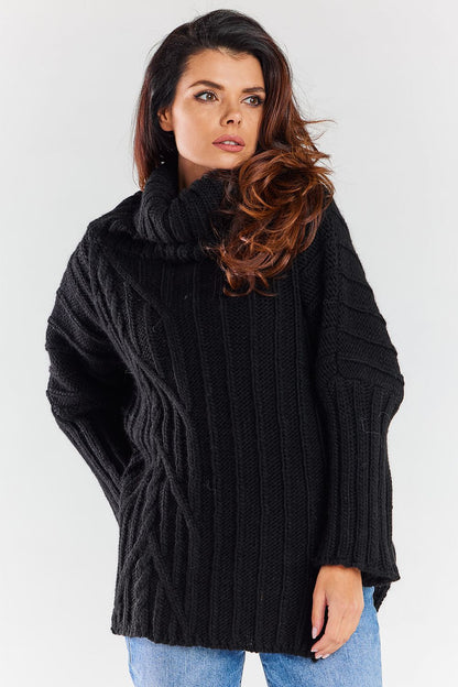 Chic black luxury women's turtleneck sweater with textured ribbing and stylish side slits, exuding warmth and elegance.