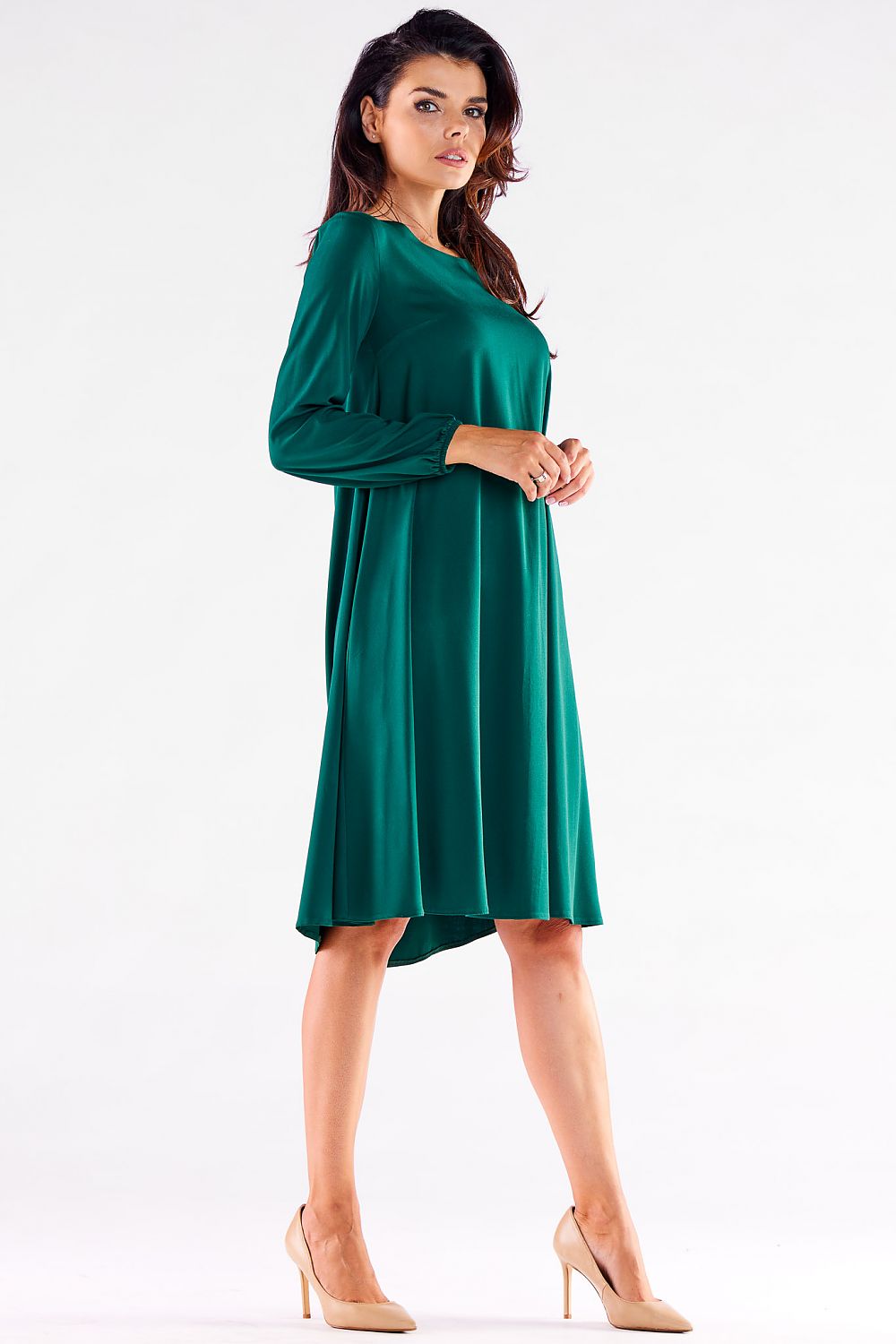 Chic women's trapezoidal daydress in vibrant green, designed with long sleeves and an elegant drape, perfect for any occasion.