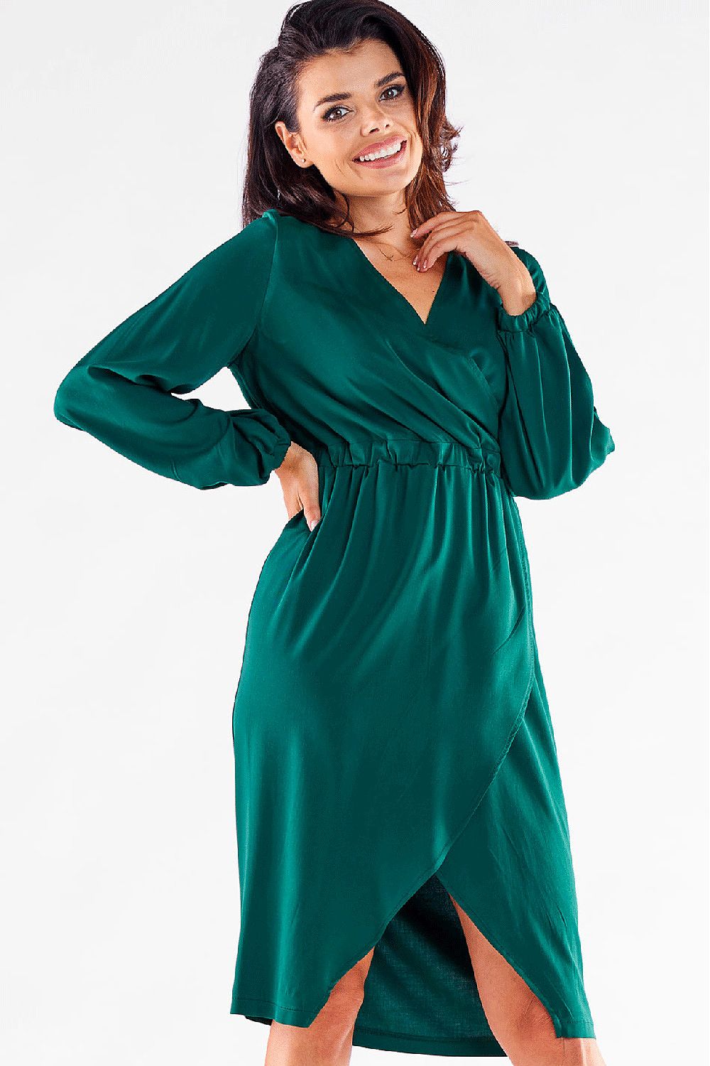 Elegant long-sleeved green Awama cocktail dress featuring a V neckline and a sultry thigh-high slit, showcasing feminine style. Perfect for chic occasions.