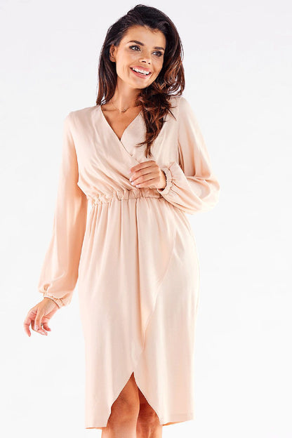 Chic blush pink cocktail dress by Awama with long sleeves and a flattering V neckline, featuring an elegant silhouette ideal for formal occasions.