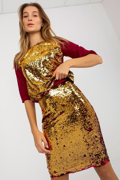 Luxury sequined pencil skirt by Lakerta, showcasing its shimmering golden sequins and chic pencil cut, perfect for elegant evening wear.