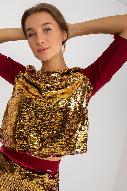 Close-up of the luxurious Lakerta blouse featuring a shimmering sequinned design, worn by a model with a sophisticated expression, perfect for upscale events.