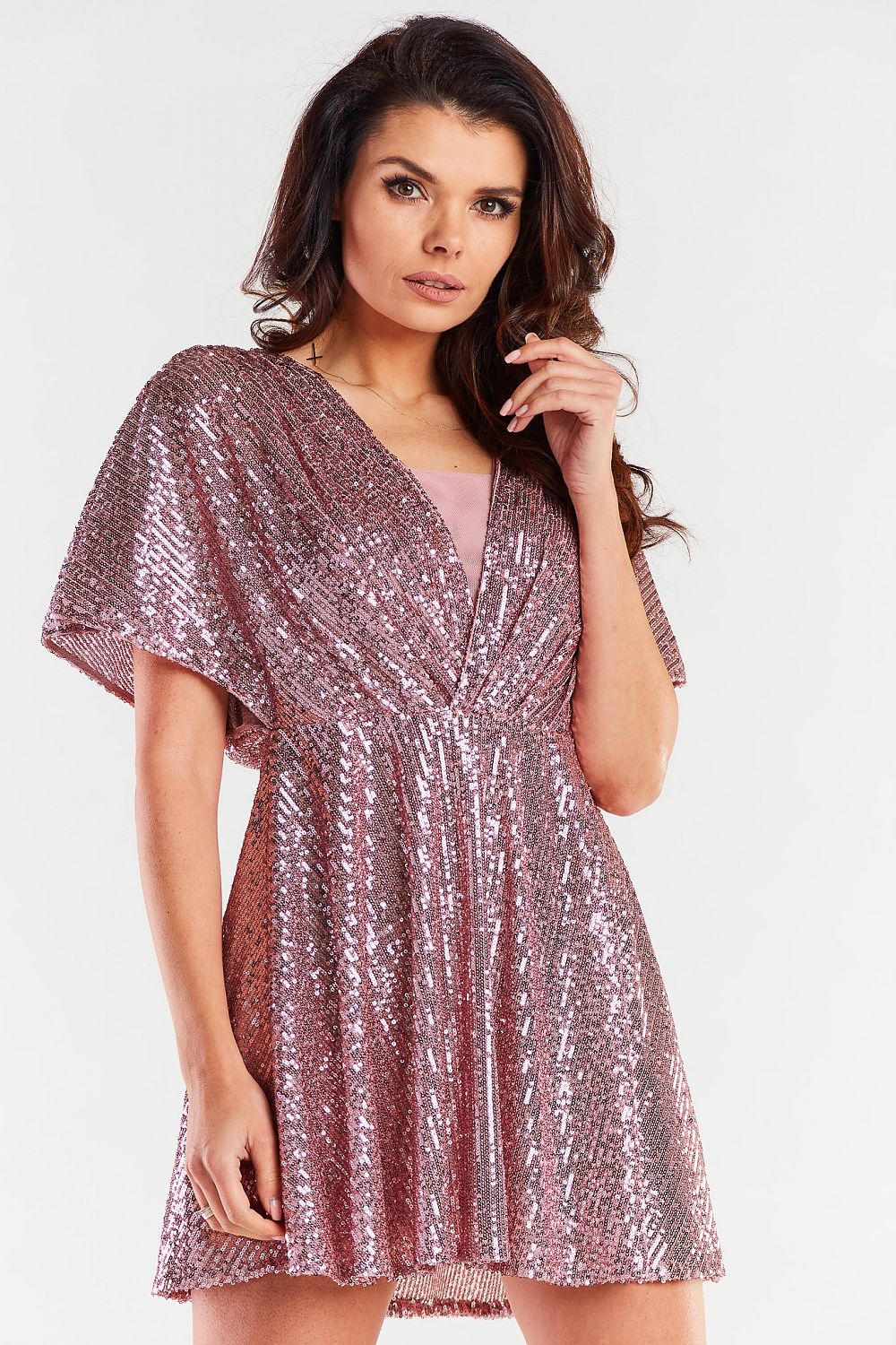 Elegant short evening dress in shimmering rose gold, featuring loose sleeves and a fitted waist, ideal for upscale occasions.