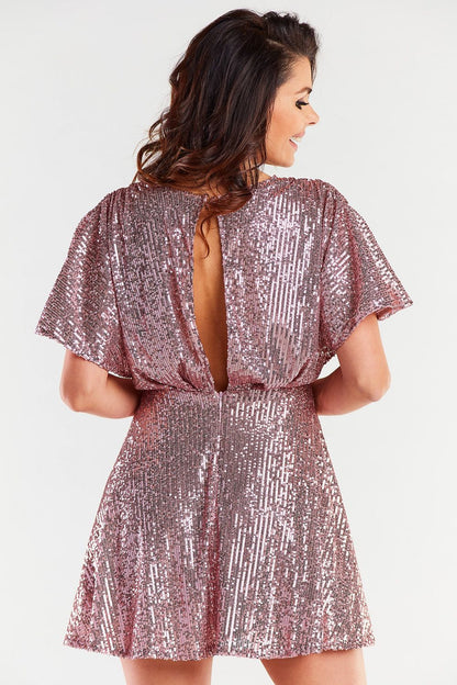 Chic back view of a rose gold evening dress with a fitted waist, highlighting its luxurious design and back fastening detail.