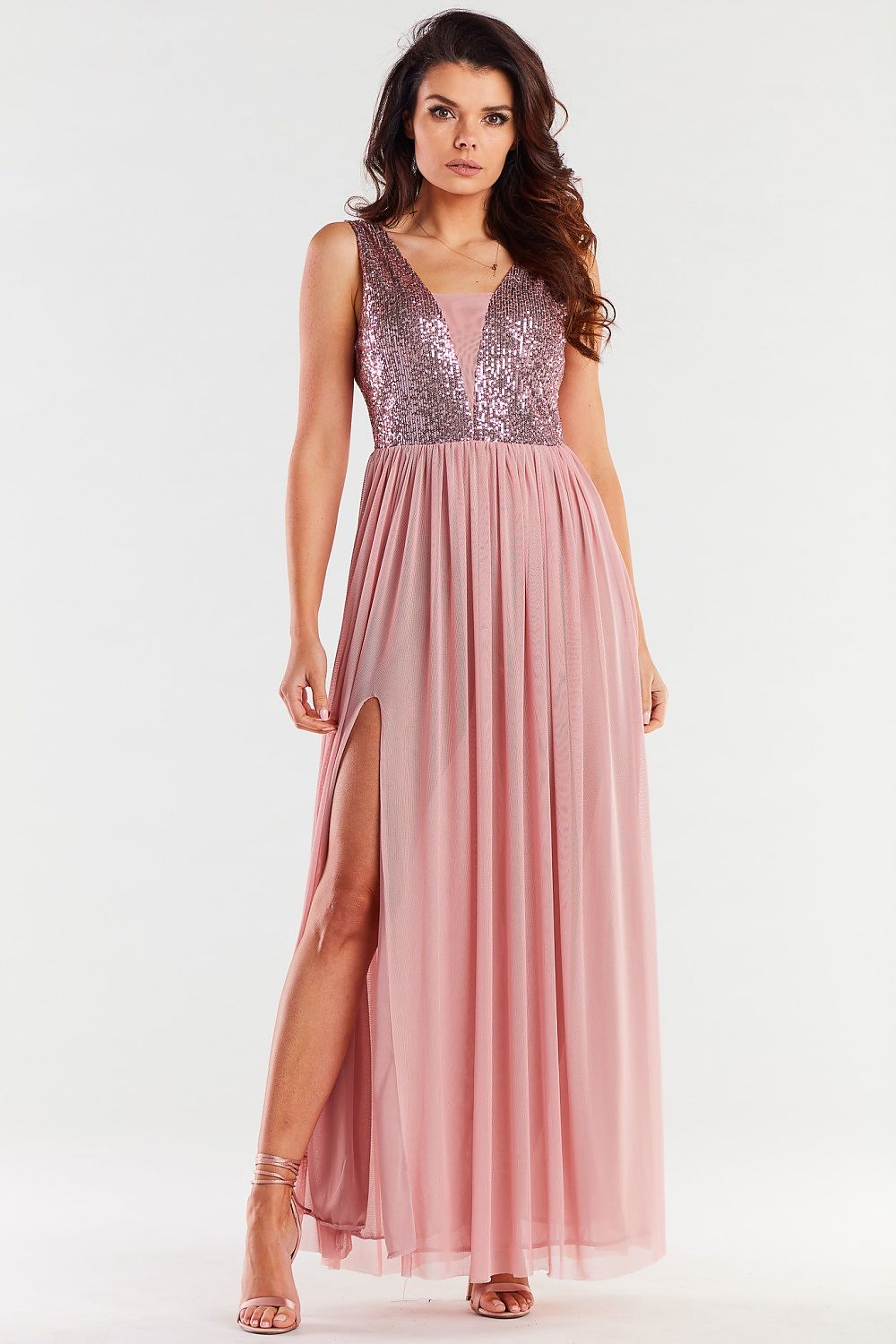 Stylish long pink dress showcasing a plunging neckline and intricate sequin detailing, complemented by a thigh-high slit for a chic look.