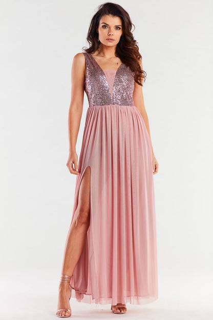Stylish long pink dress showcasing a plunging neckline and intricate sequin detailing, complemented by a thigh-high slit for a chic look.
