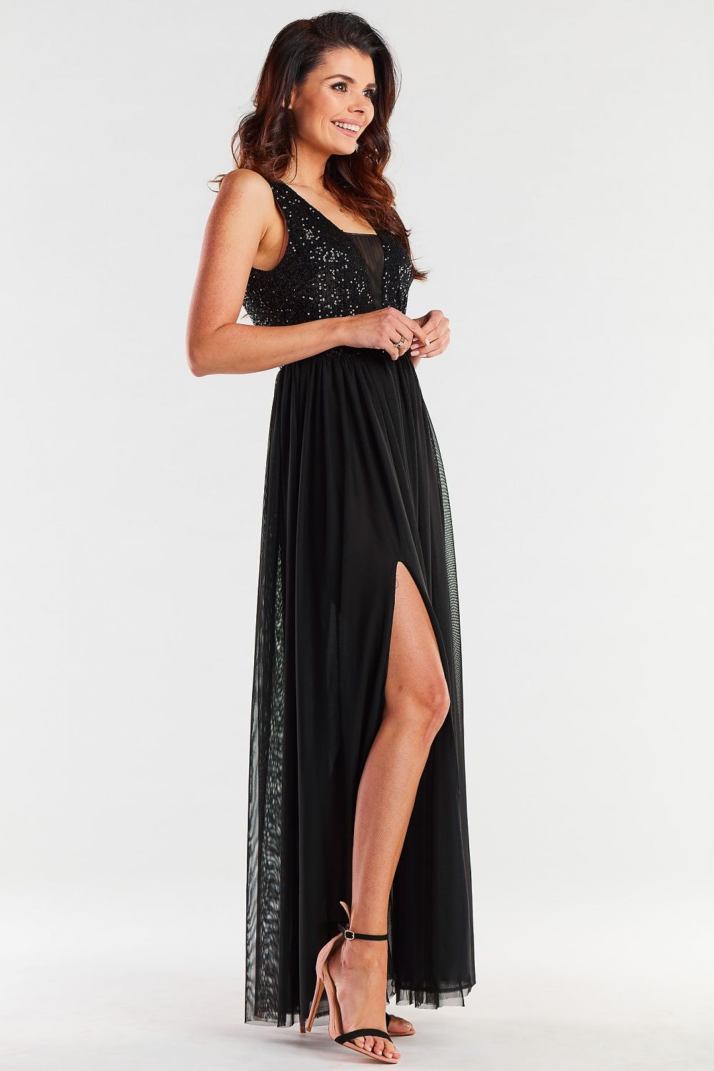 Charming black long dress with a deep v-neckline and sequin accents, elegantly styled with a thigh-high slit, perfect for formal occasions.