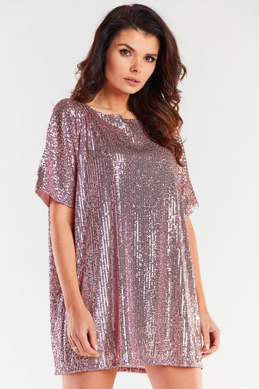 Stylish loose evening dress in shimmering rose gold sequins, featuring a flattering heart neckline. Designed for elegance and comfort, this dress exemplifies luxury fashion, perfect for special occasions. Crafted in Poland, it offers a chic and versatile fit for all body types.