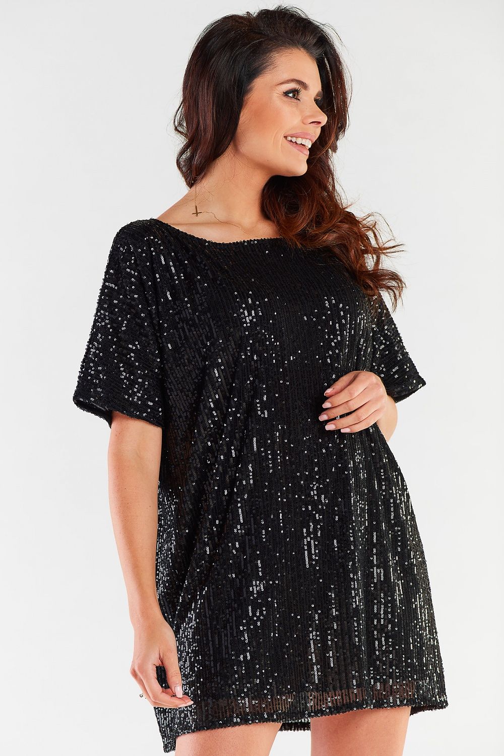 Side profile of a glamorous black sequined dress, highlighting its exquisite design and luxurious appeal for evening occasions.